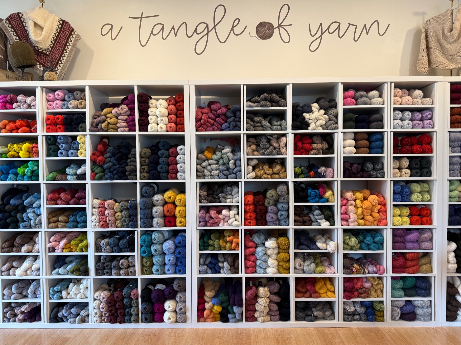 Inside A Tangle of Yarn — shelves of hand-picked yarn