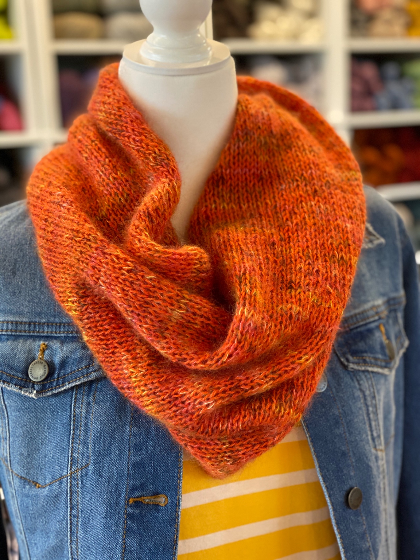 The finished cowl styled with a denim jacket